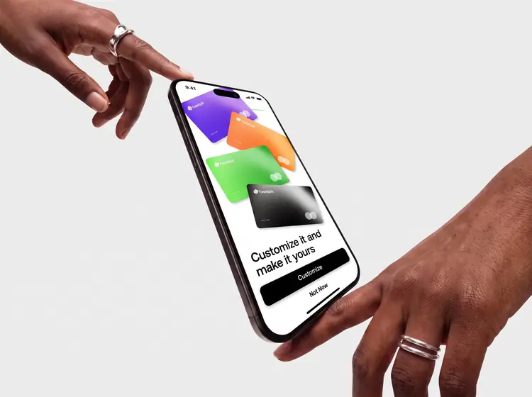 A phone passing from one hand to another