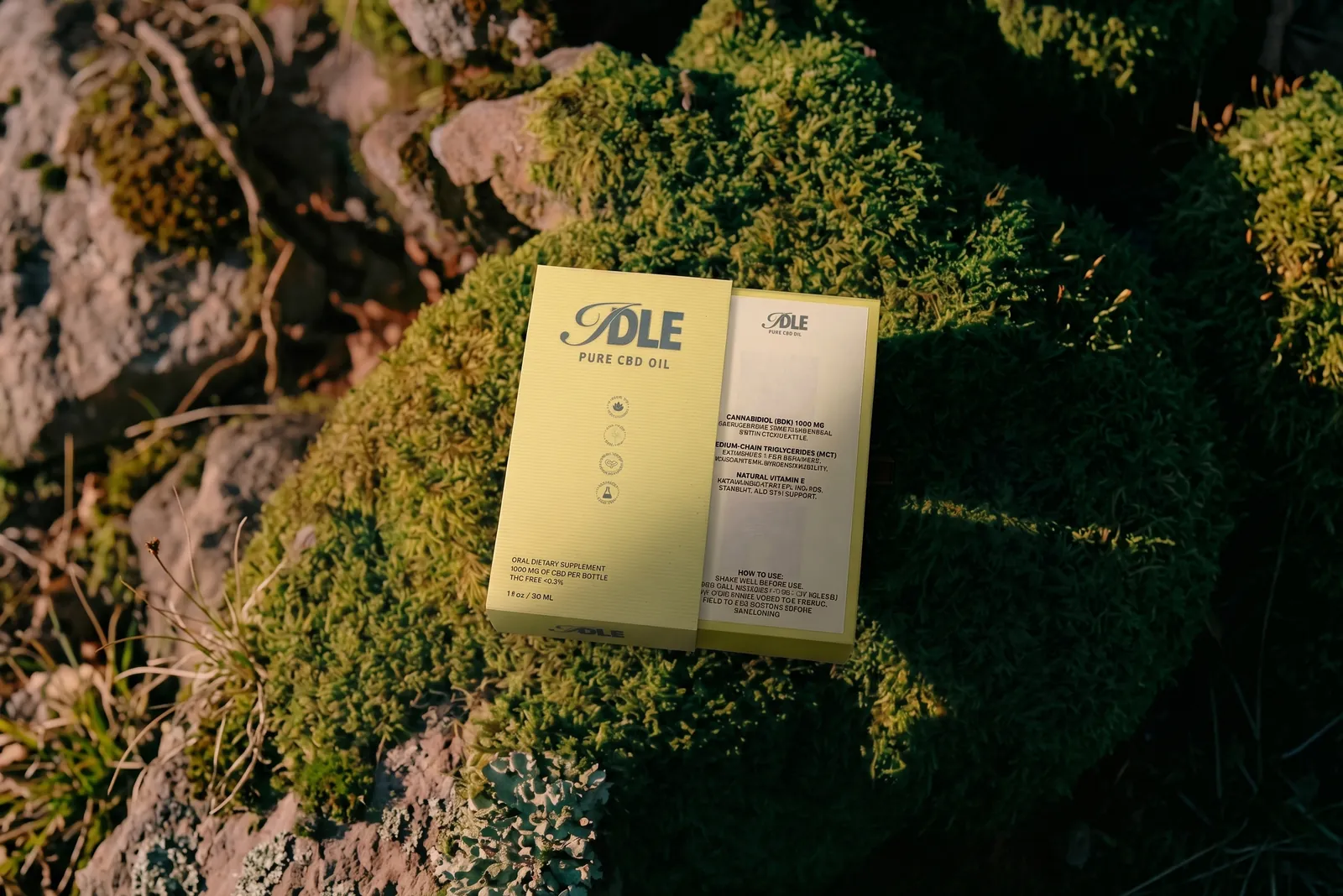 IDLE CBD Oil — the box on the moss